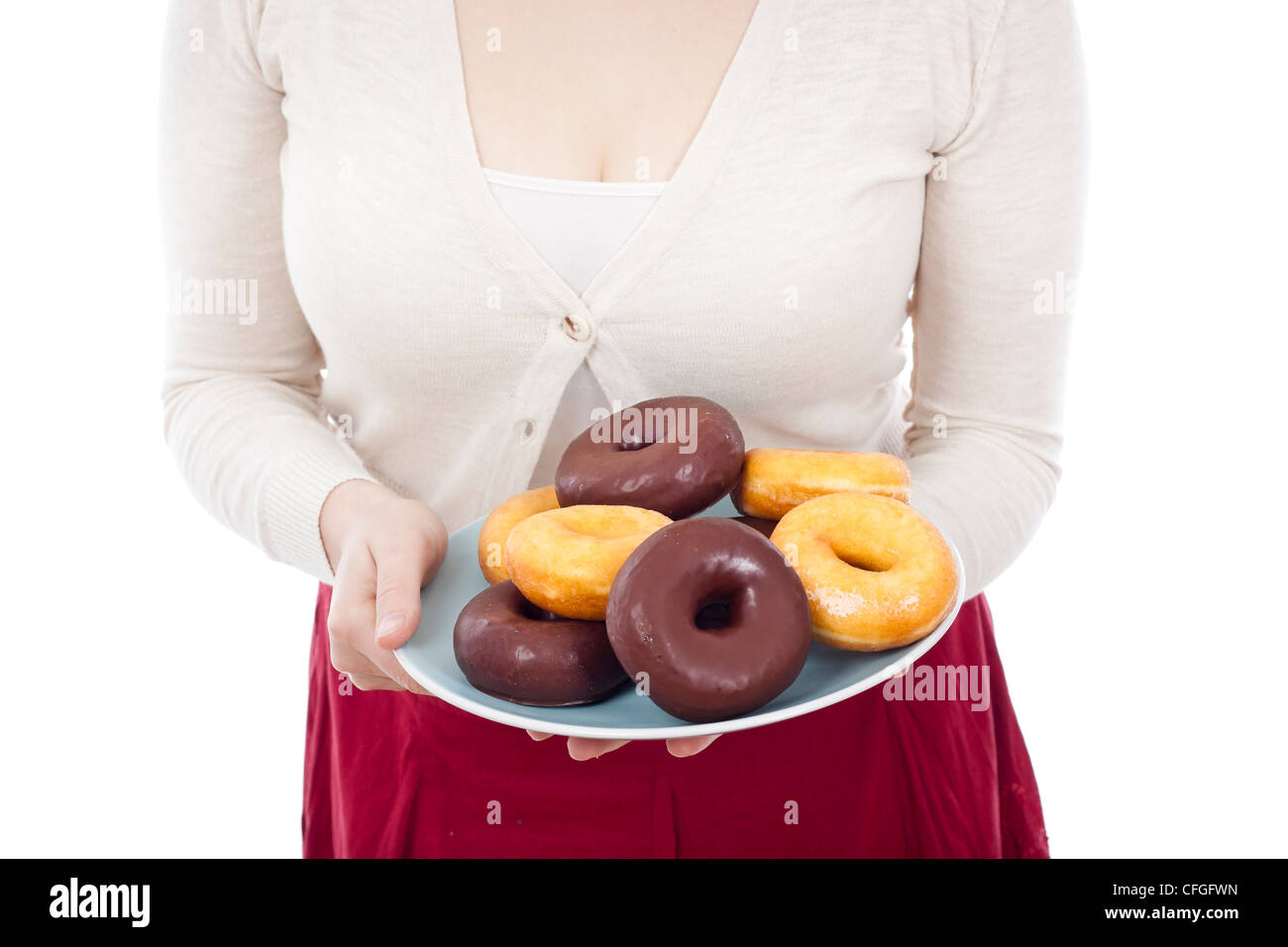 Detail of woman holding plate with fresh donuts, isolated on white background. Stock Photo