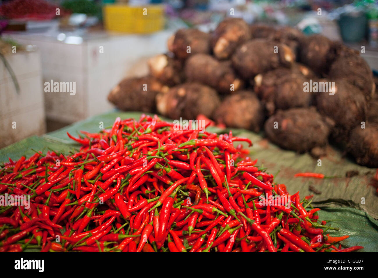 Red chili peppers for sale at Yangshuo market, China Stock Photo - Alamy