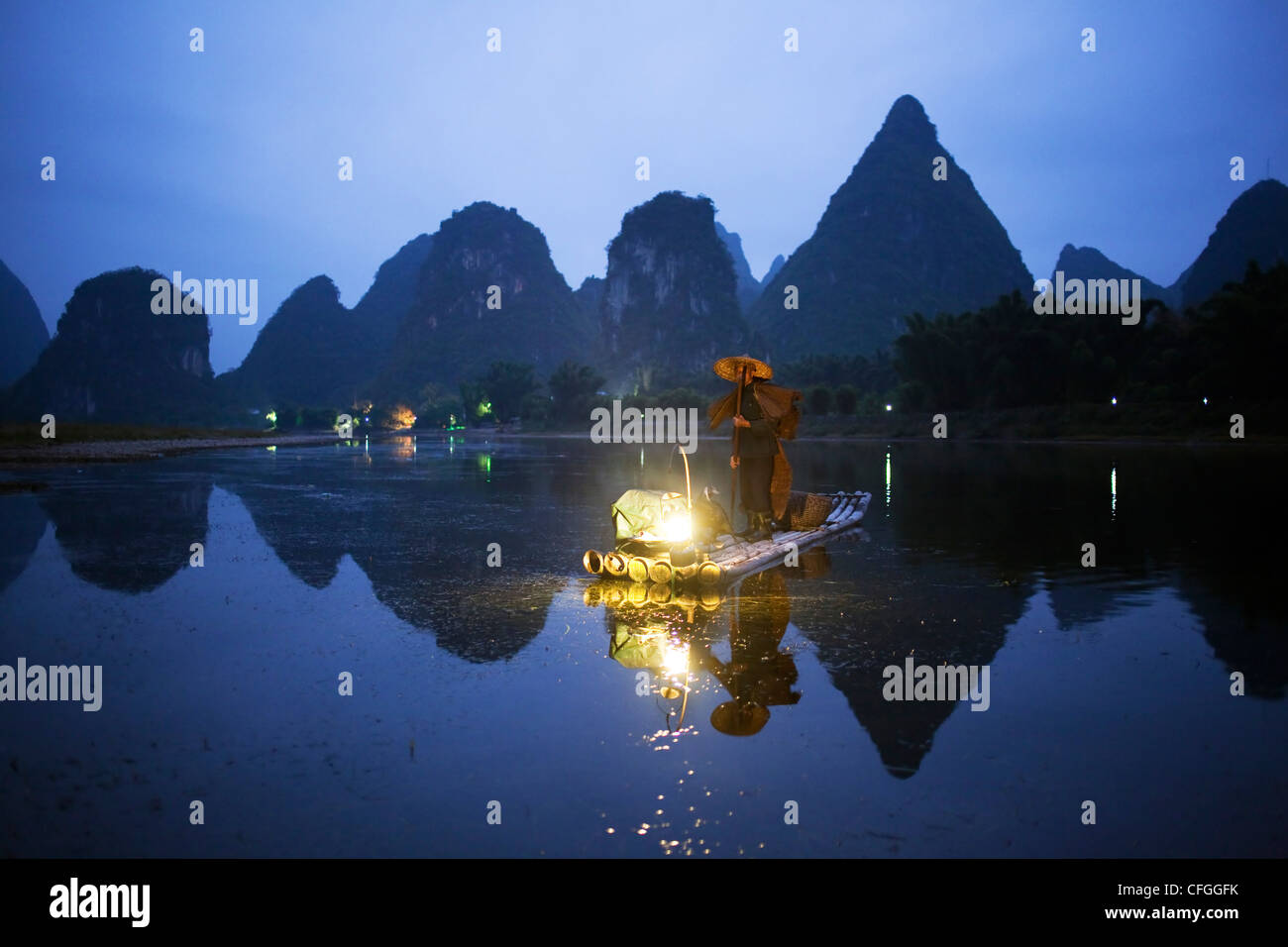 A cormorant fisherman on the river in Yangshuo, rural China Stock Photo