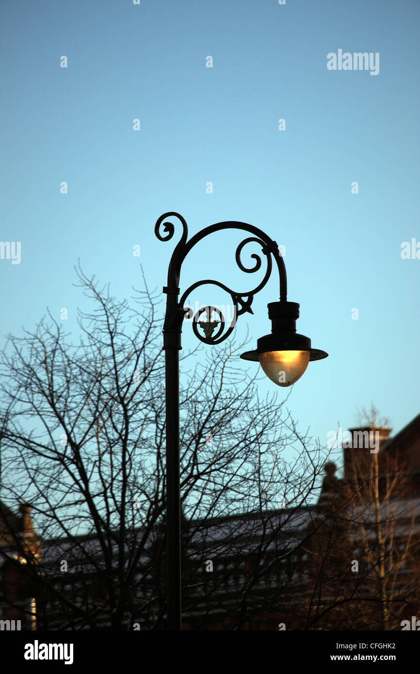 Lit Victorian style lamp post in Glasgow Scotland Stock Photo