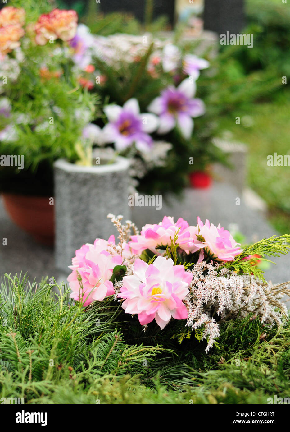 Funeral flowers placed on the grave at All souls holiday Stock Photo