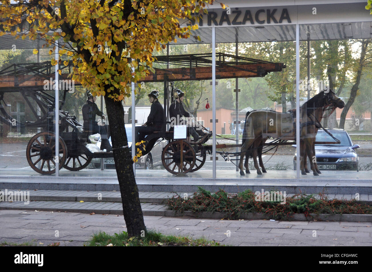 A SCULPTURE OF A HORSE DRAWN FIRE FIGHTING TENDER AND CREW GDANSK POLAND EUROPE Stock Photo