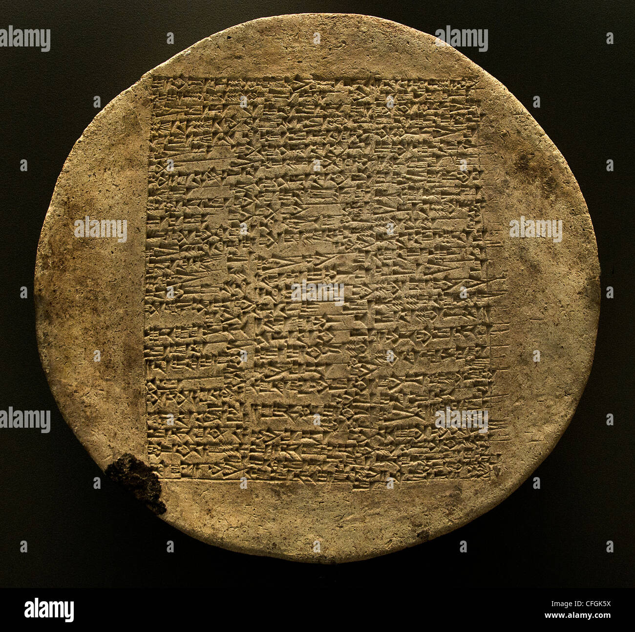 This disc is actually the head of a large 'nail  Yahdun Lim king of Mari 1800 BC palace of Zimri-Lim. Stock Photo