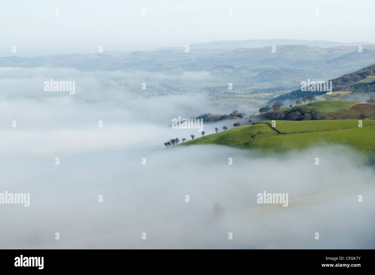 Misty valleys below the Mynydd Epynt hills in mid Wales, Powys UK. Stock Photo