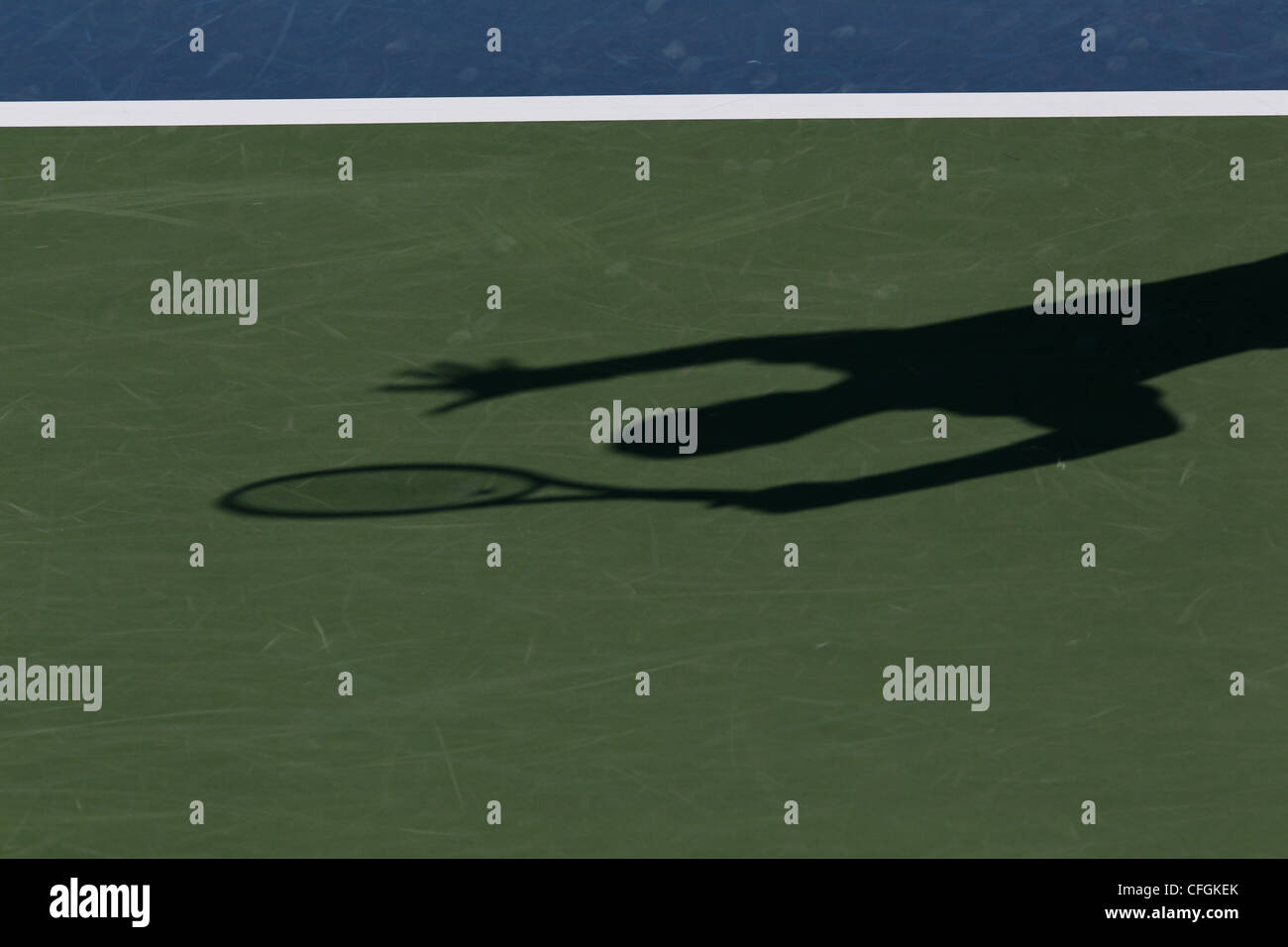 Shadow of a tennis player on the court. Stock Photo