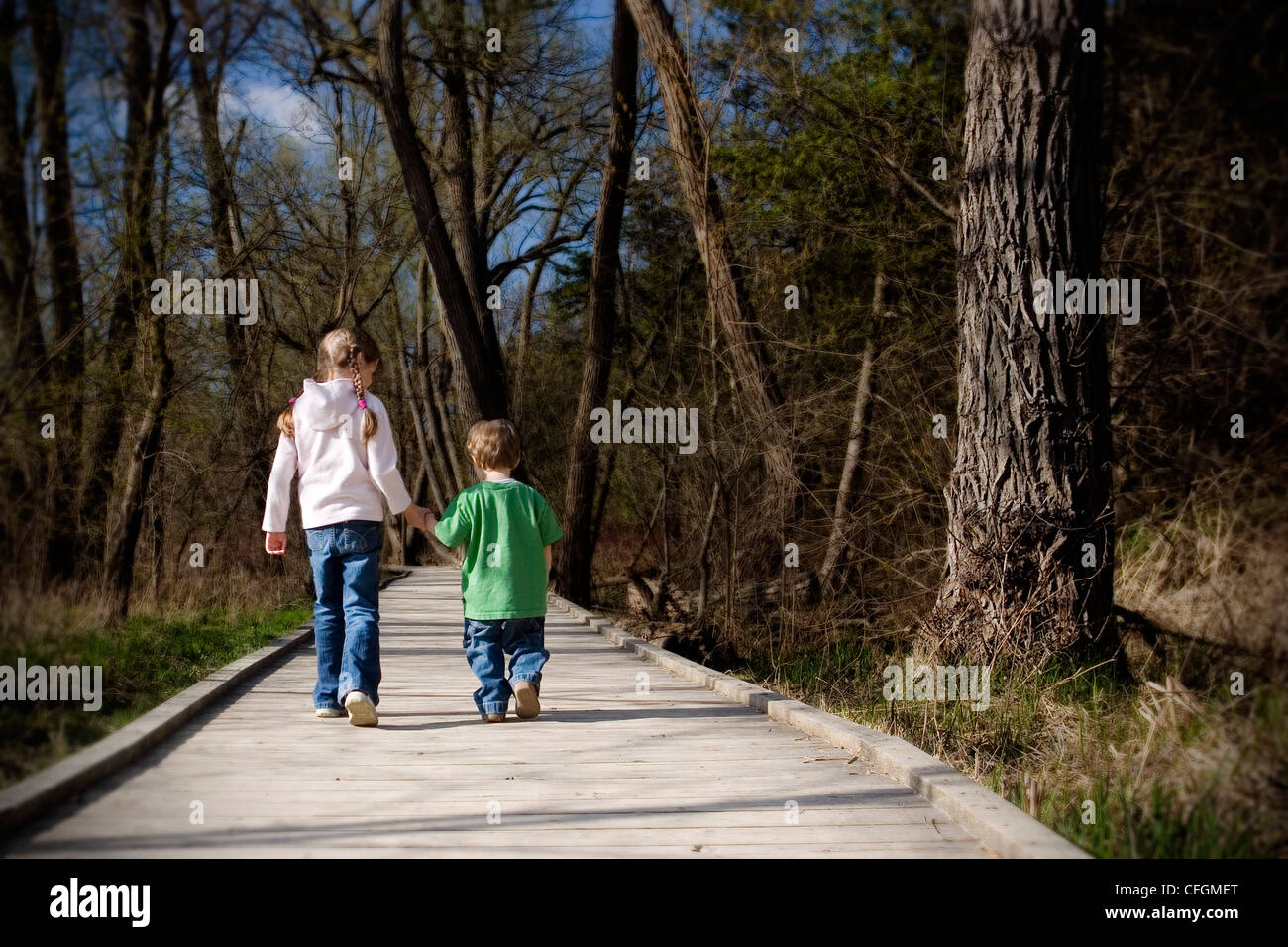 Brother and Sister Holding Hands Walking on Boardwalk. Newmarket ...