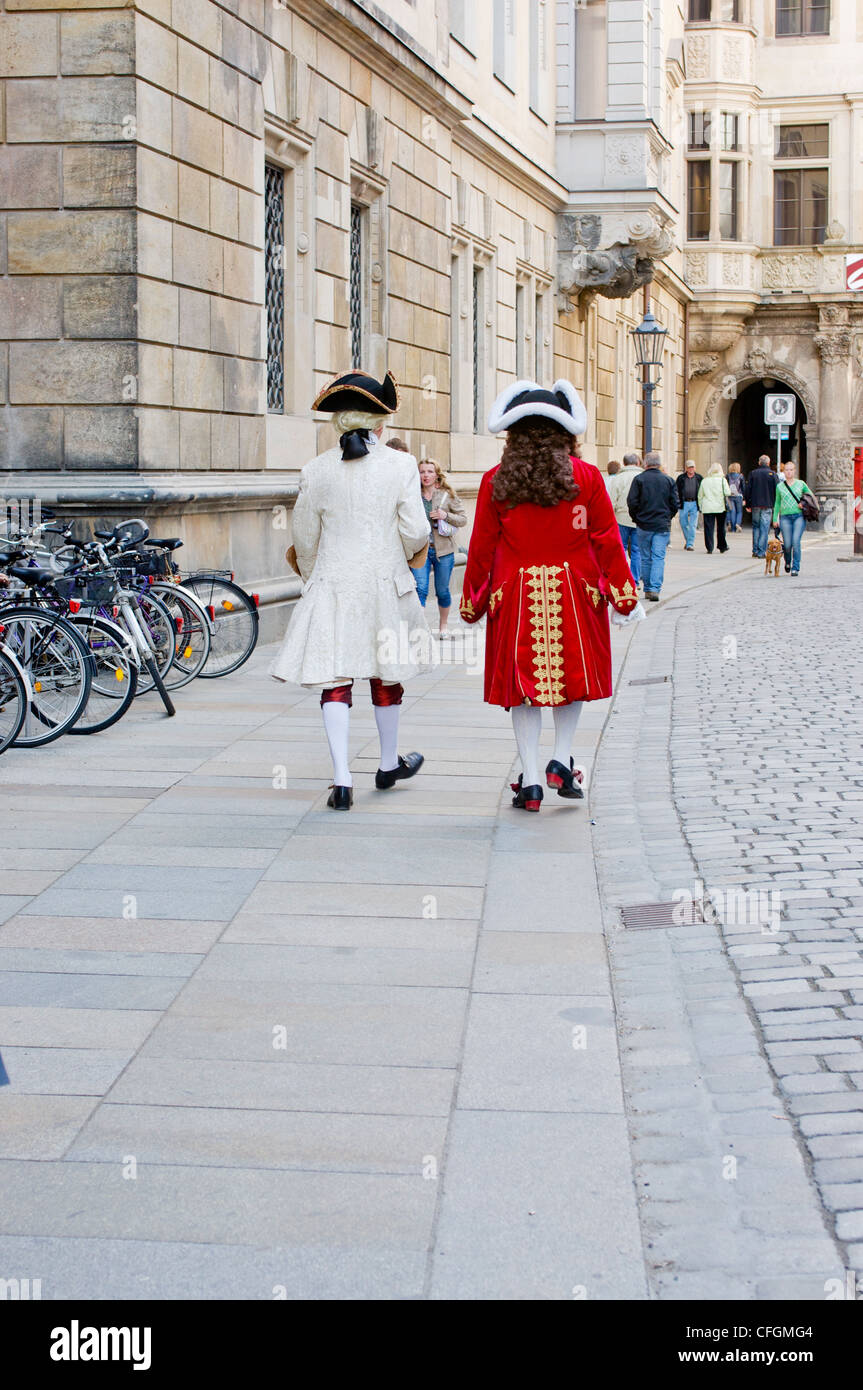 Men in historical clothing walk through the historic district of Dresden, Germany. Stock Photo