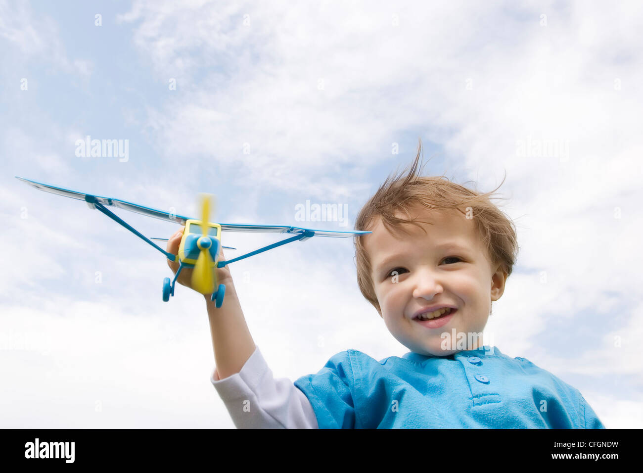 Young Boy Playing with Toy Plane Stock Photo - Alamy