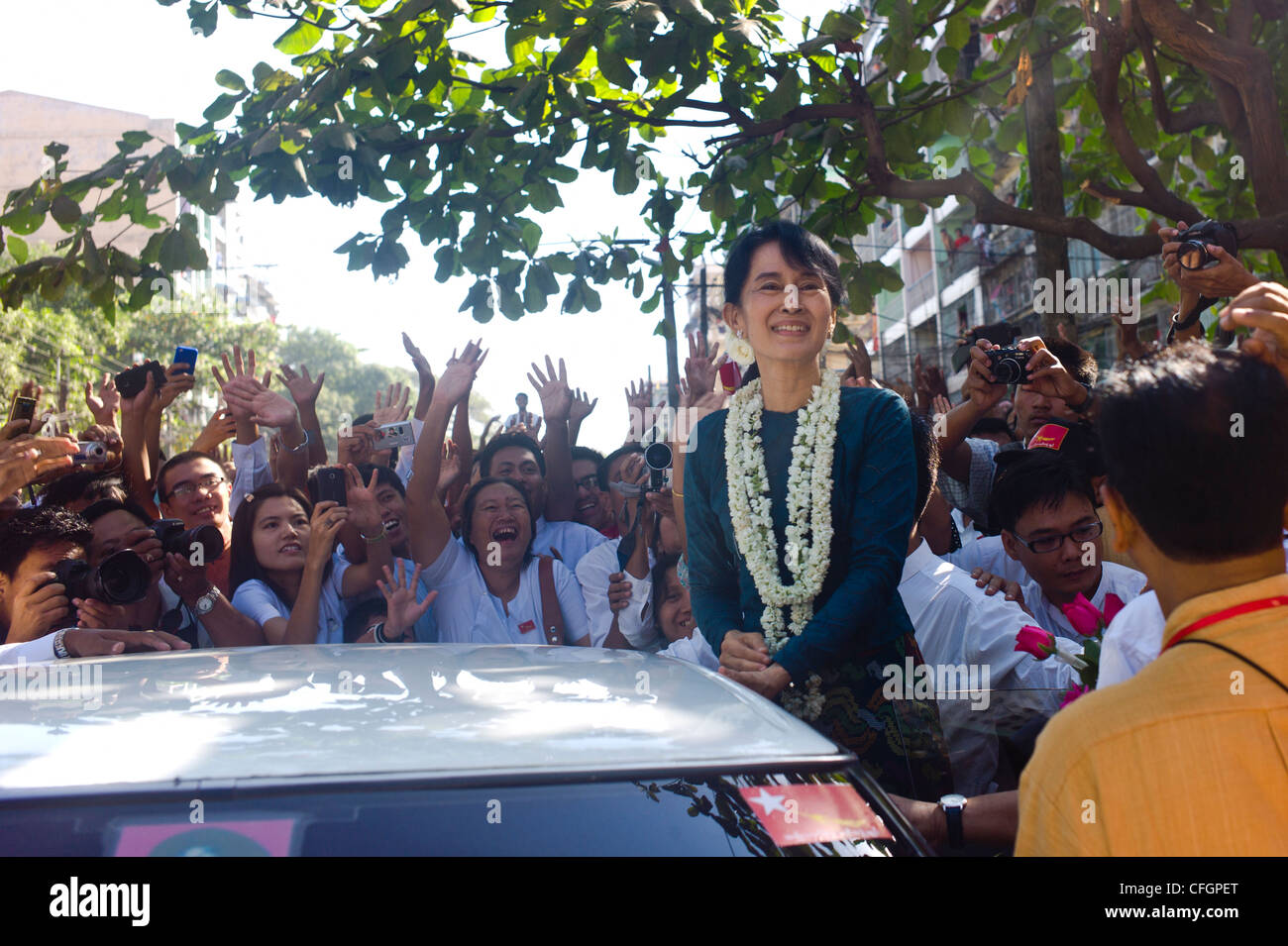 Aung San Suu Kyi, leader of the National League for Democracy (NLD) meets crowds of well wishers in Yangon Myanmar during the 2012 election campaign where she is standing to become a Member of Parliament in Myanmar's new civilian government Stock Photo