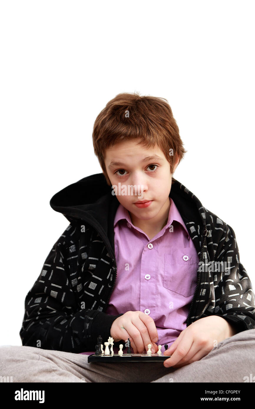 Clever boy plays chess Stock Photo