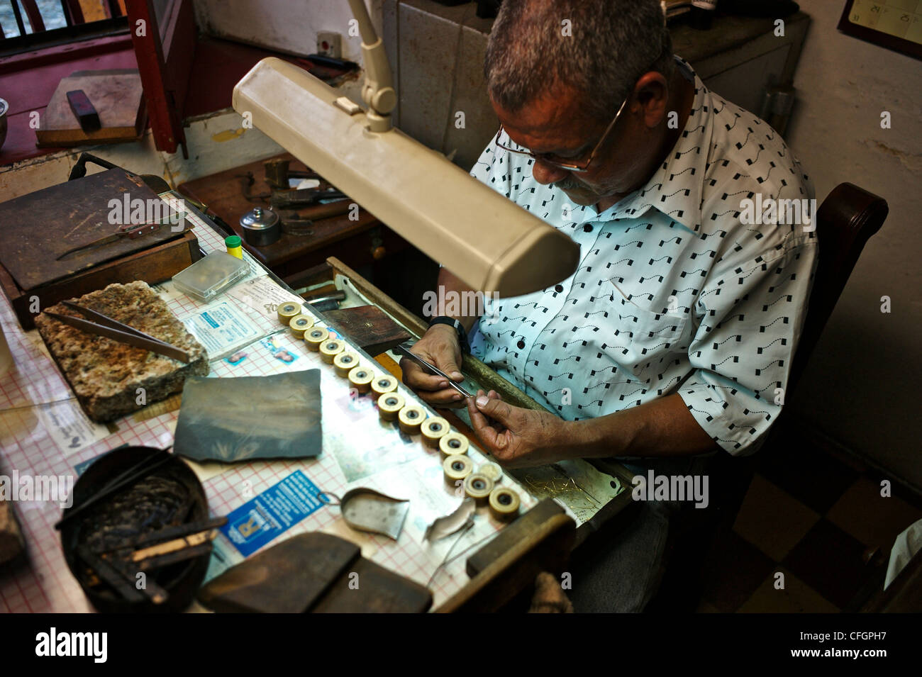 A worker fixing clocks. Stock Photo