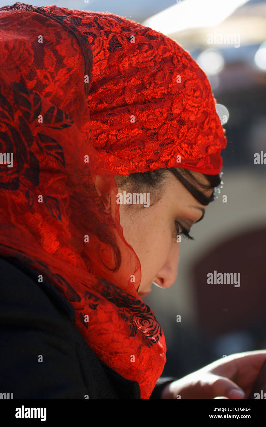 Woman in red headscarf Stock Photo