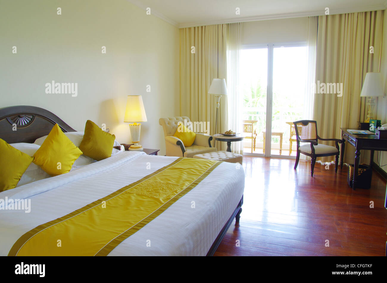 Luxurious hotel room interior with bed Stock Photo