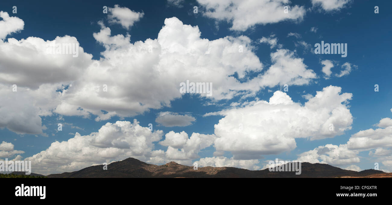Altocumulus undulatus and cumulus clouds. Blue cloud sky panoramic Stock Photo