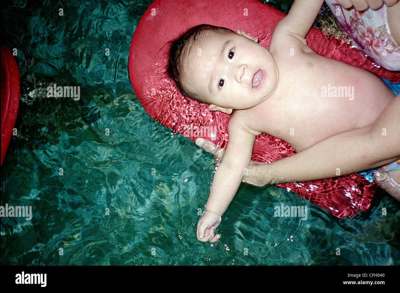 Baby Floating in Pool with Mother, Montreal, Quebec Stock Photo Alamy
