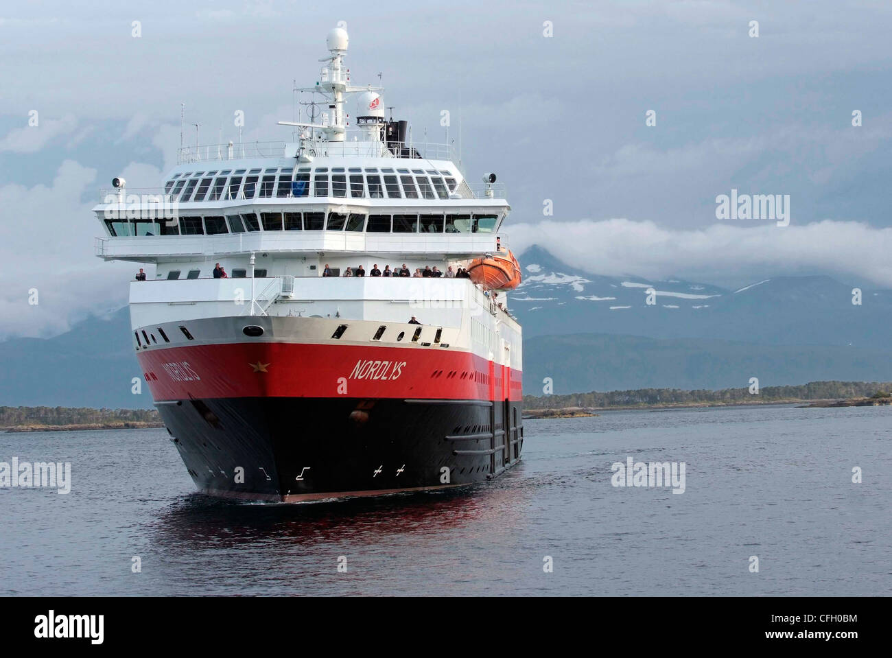NORWAY Molde Hurtigrute MV Nordlys arrives. Molde Panorama in background Stock Photo