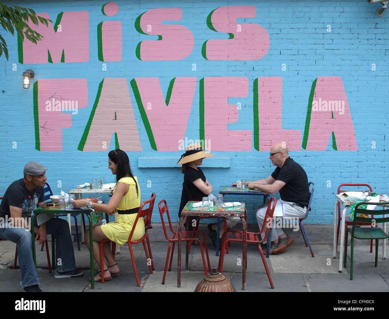 Customers enjoying outdoor patio of Brazilian restaurant, Miss Favela, Brooklyn, New York Stock Photo