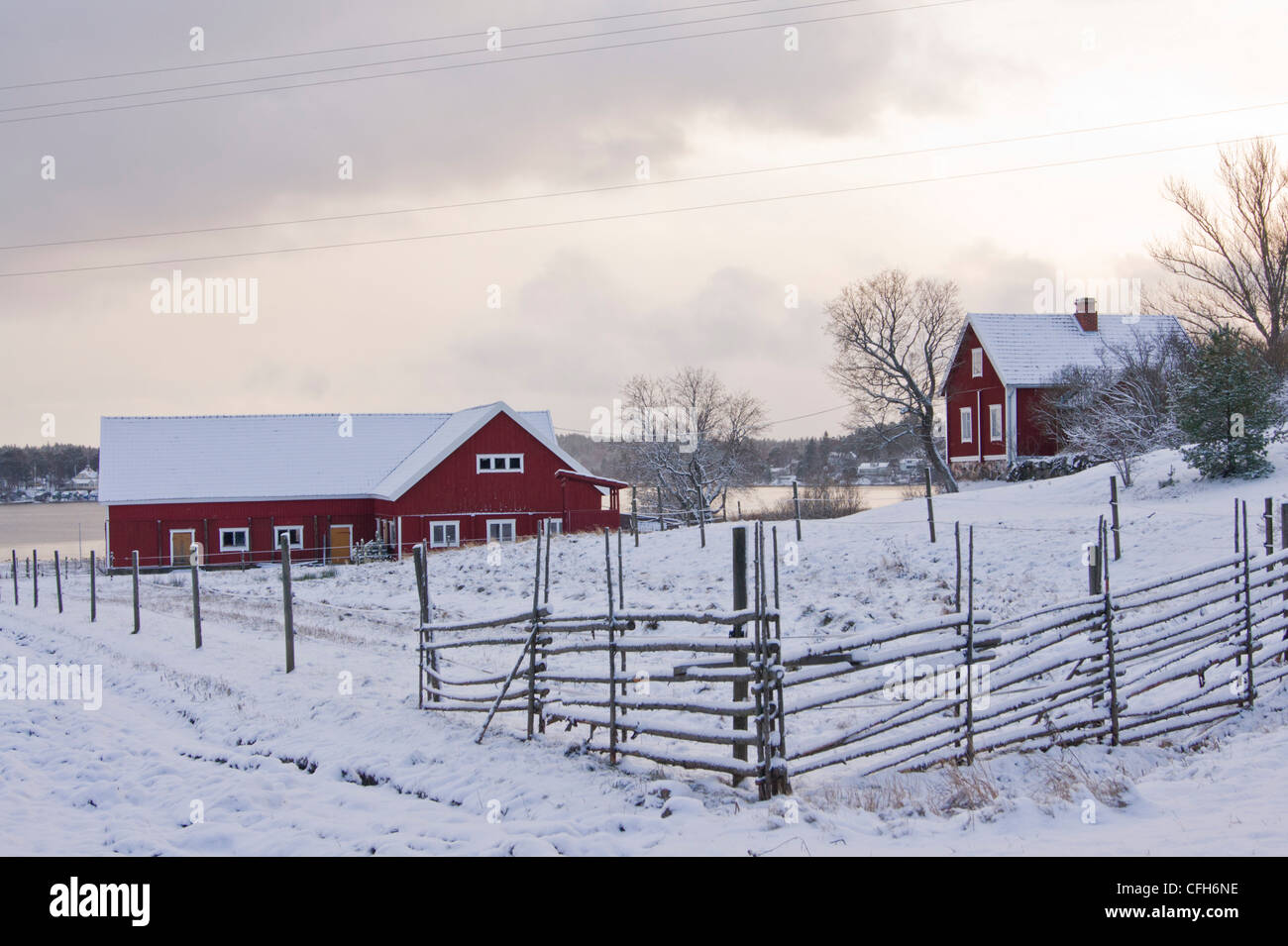 Traditional red wooden farmhouses in Finland Stock Photo
