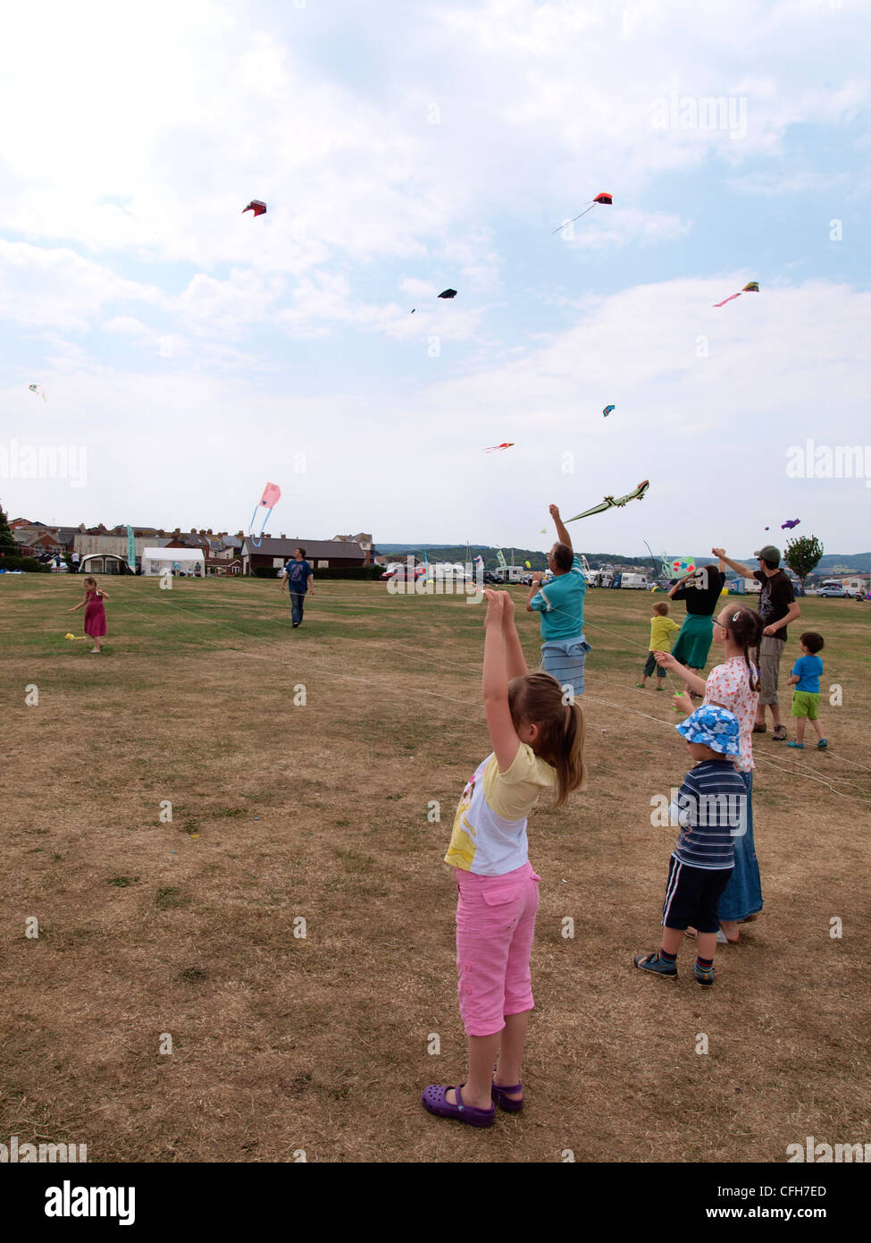 Children flying kites they made at the Exmouth Kite Festival, Devon, UK