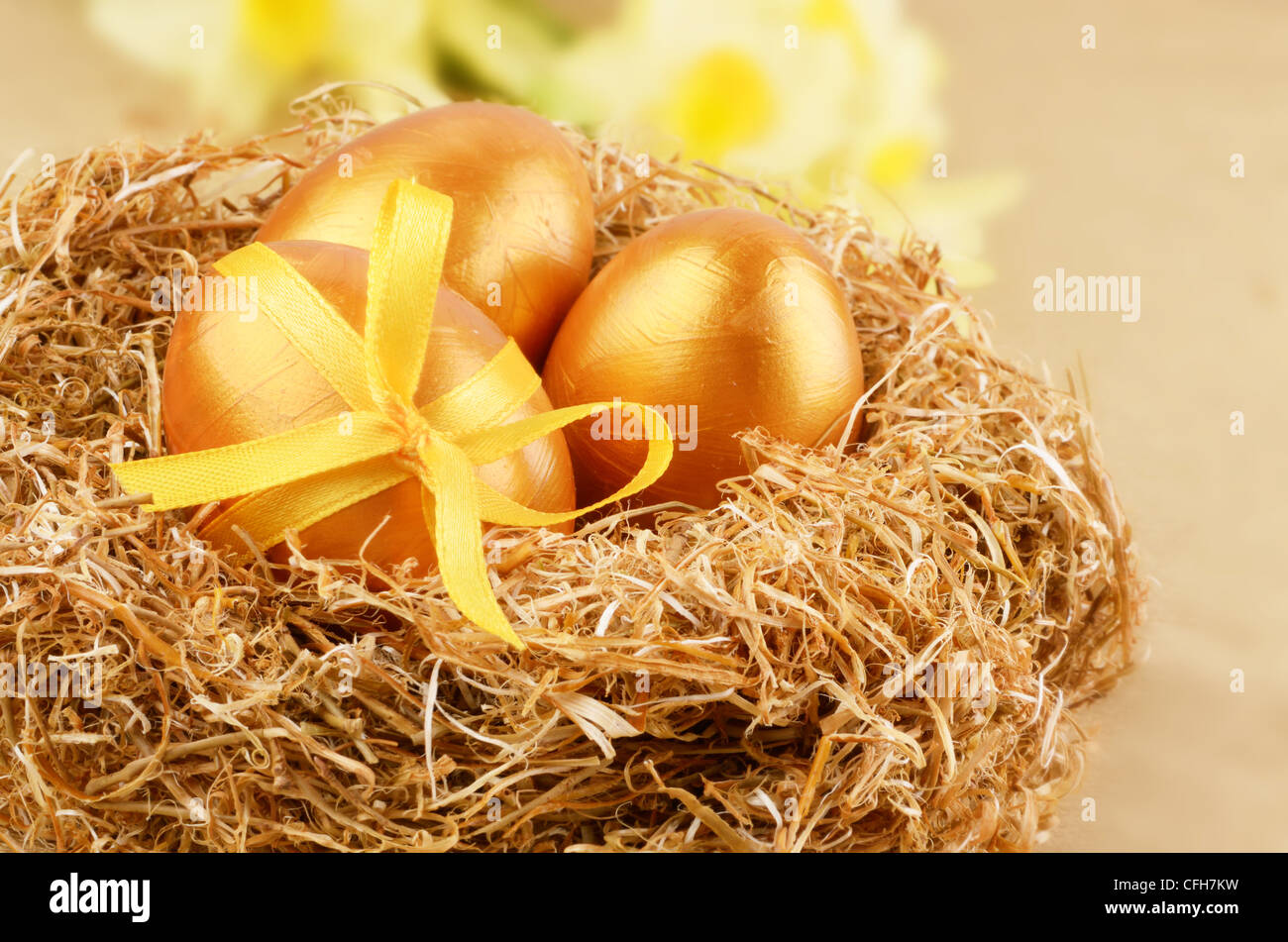 Golden Easter eggs in the nest over gold background Stock Photo - Alamy