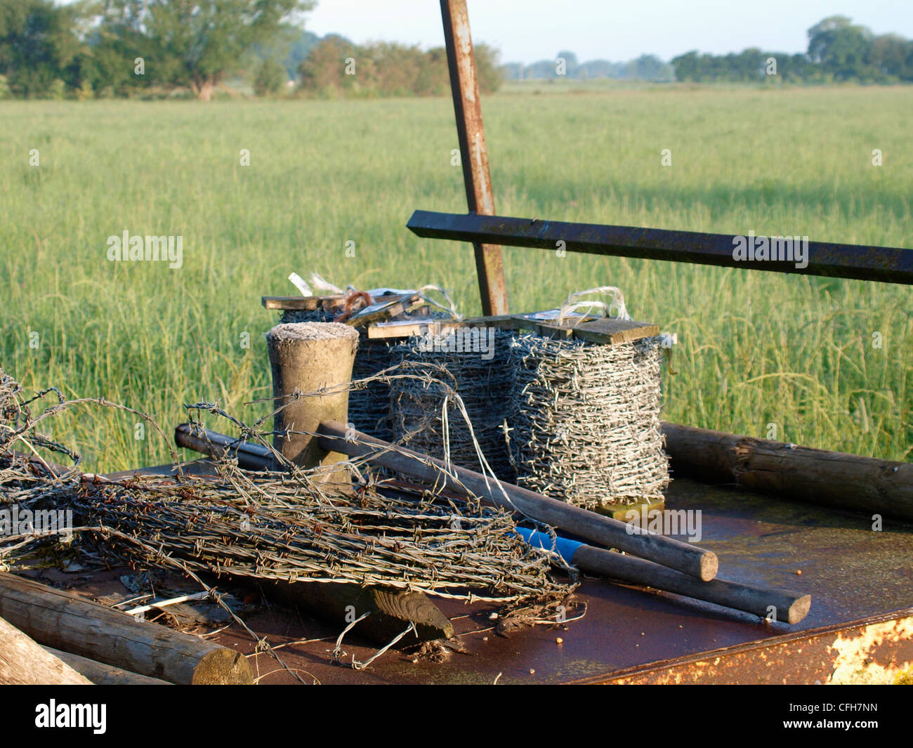 Barbed wire ready for fencing, UK Stock Photo