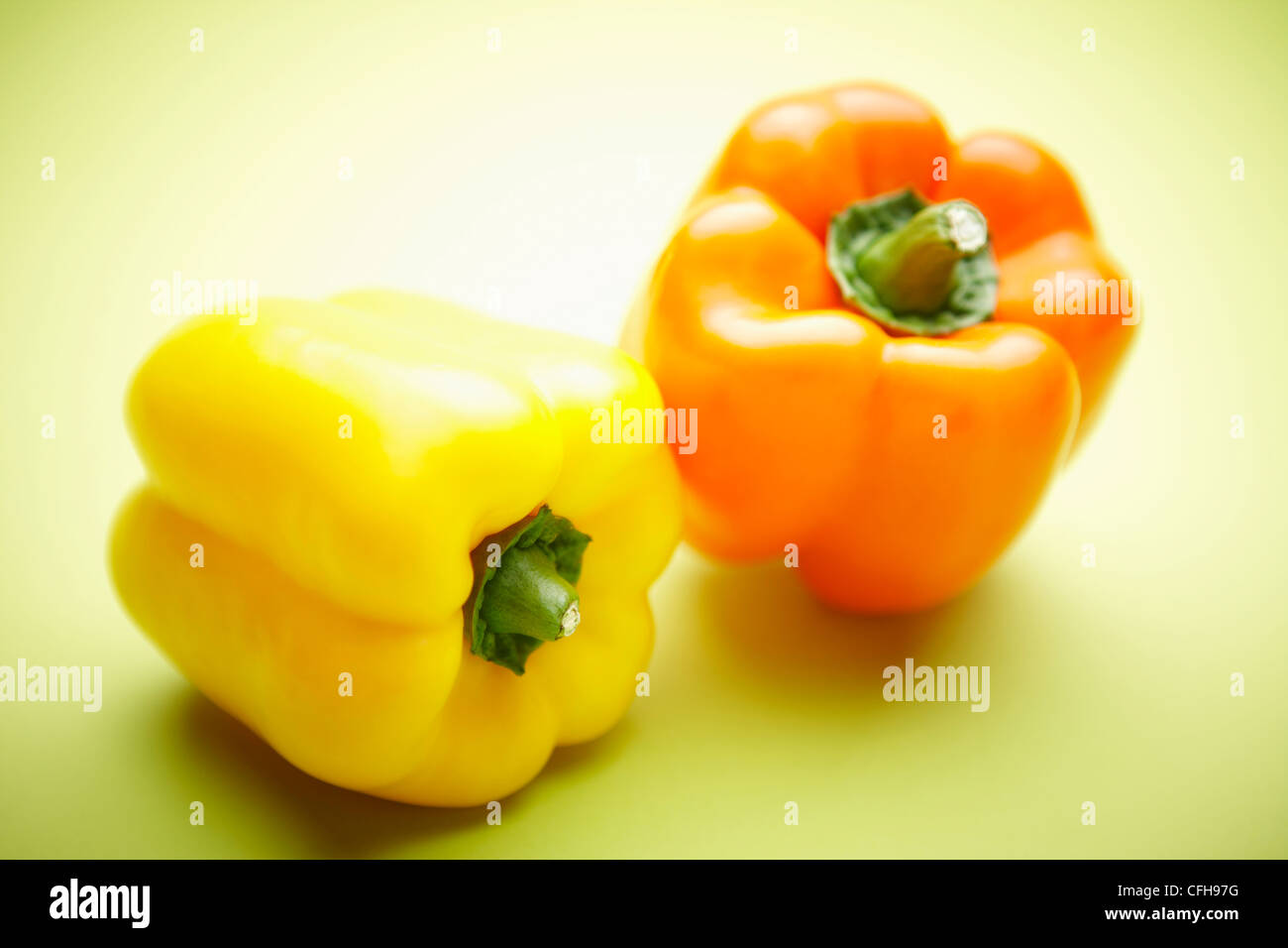 The colorful bell peppers with the green background Stock Photo - Alamy