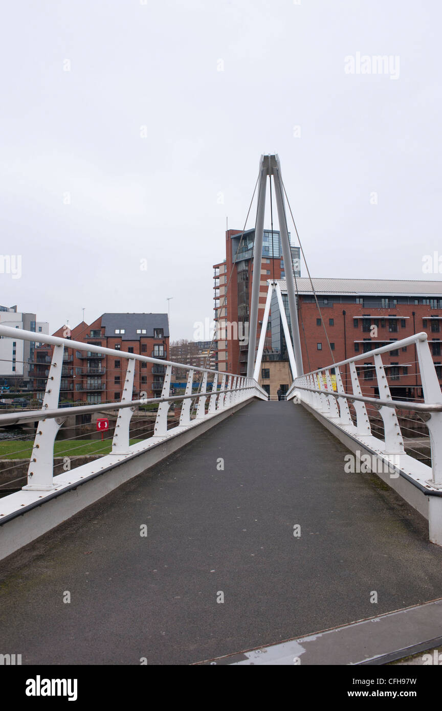 View over footbridge over River Aire from Royal Armouries towards Leeds Stock Photo