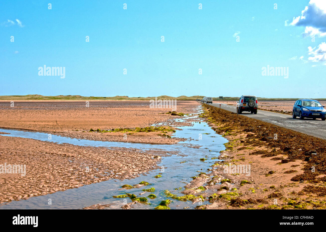 northumberland holy island causeway Stock Photo Alamy