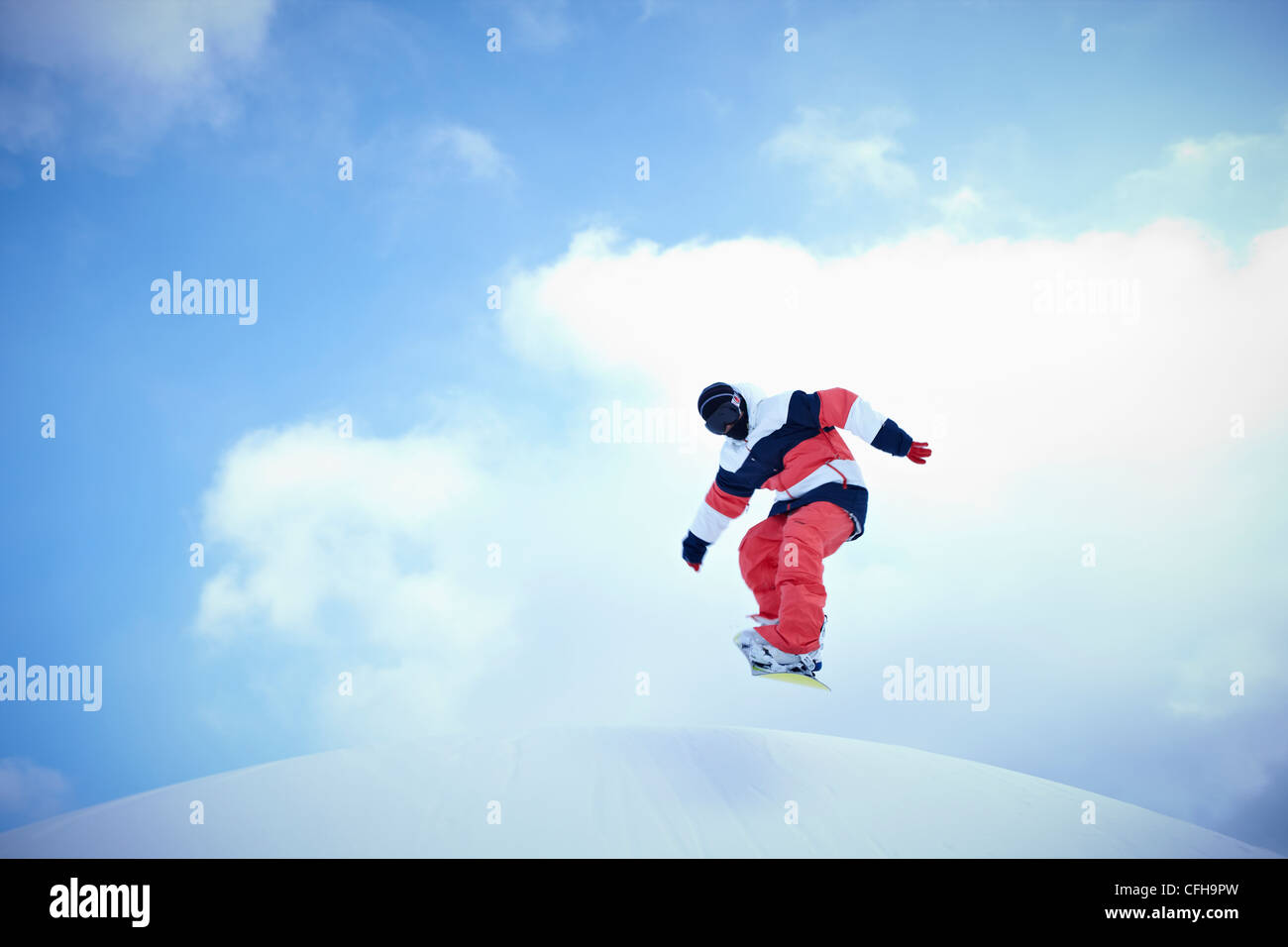 The man jumping on the snowboard Stock Photo - Alamy