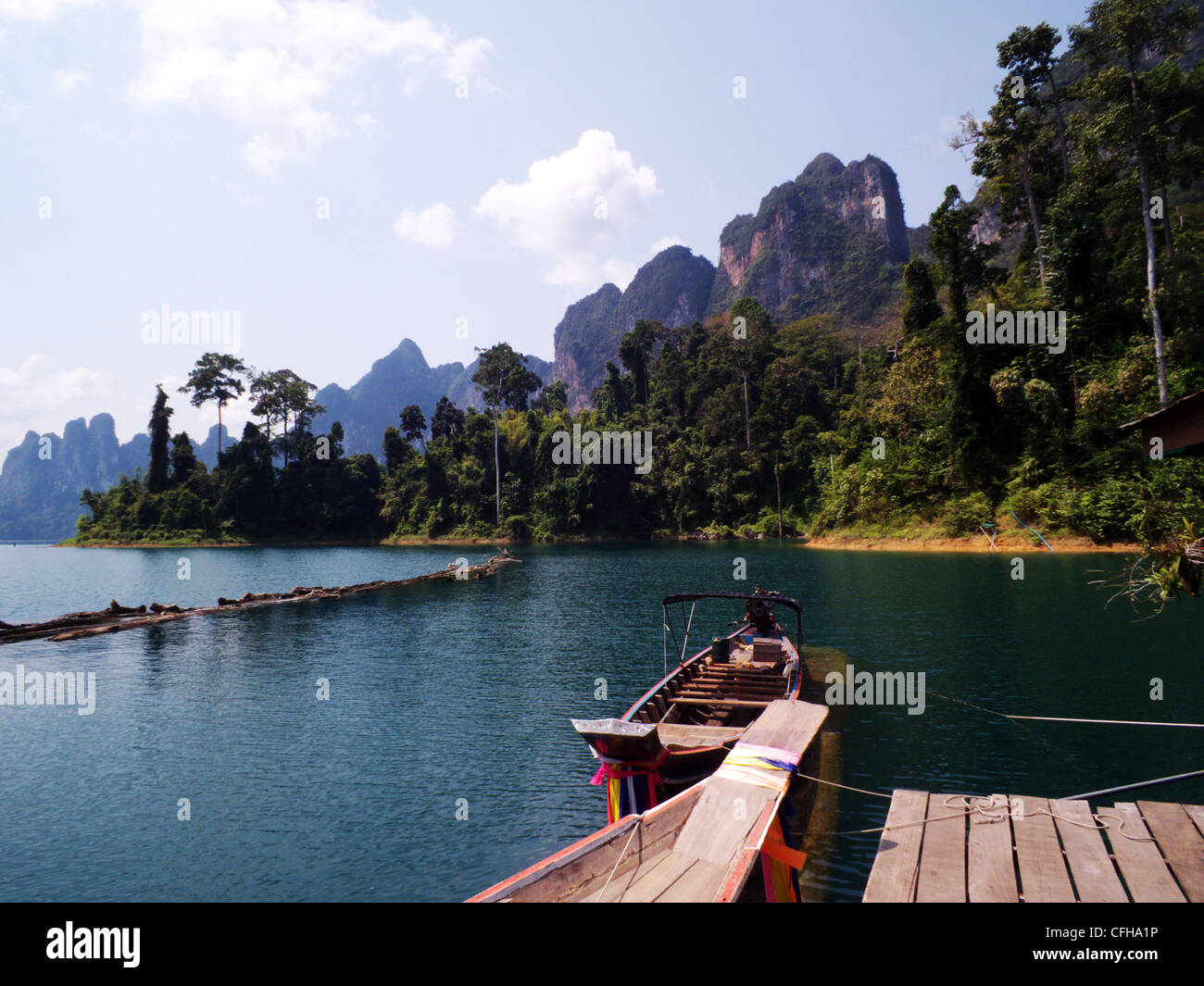 Khao Sok National Park, Cheow Lan Lake. Thailand. View of our long tail, engined boat, moored to the floating hotel jetty. Stock Photo