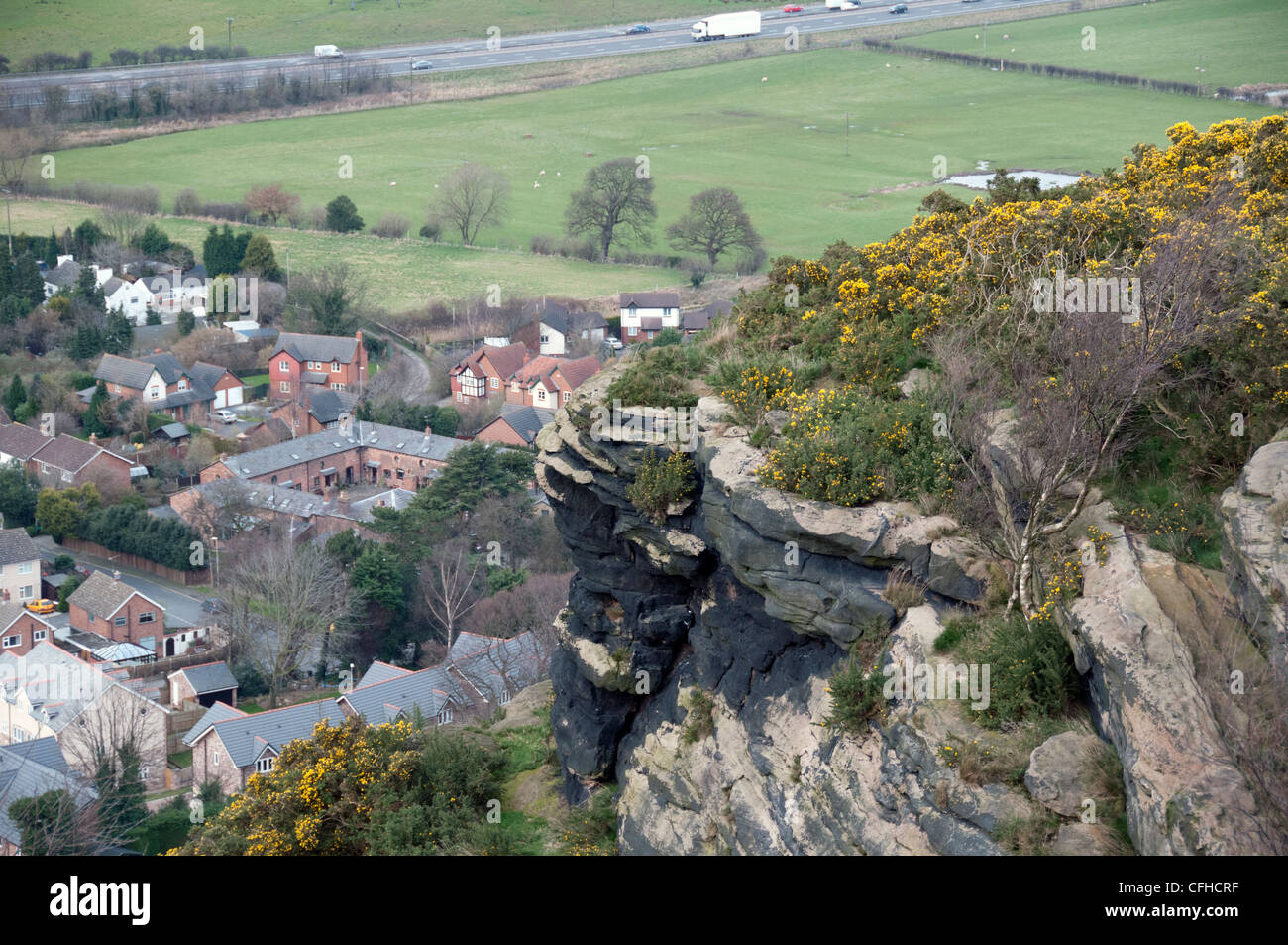 Helsby Hill overlooking Helsby and the Mersey Estuary showing the cliffs and outcrop of rock in Cheshire Stock Photo