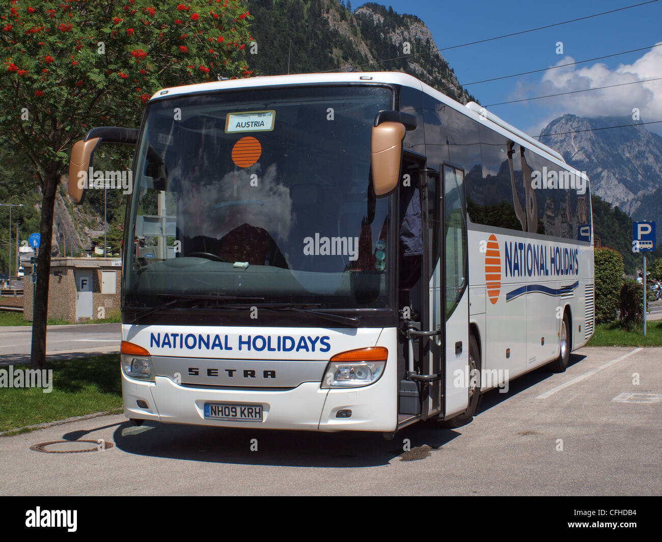 National Express coach situated at lake Traunsee in the town of Ebensee in the Austrian Alps west of Saltzburg Stock Photo