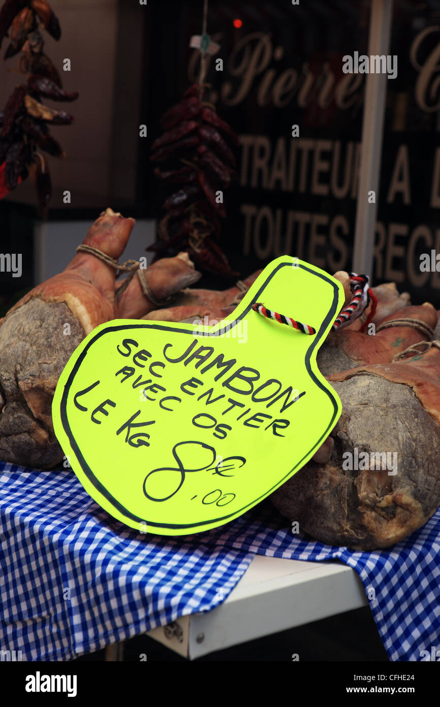 Cured ham on the bone on sale at Brantome in the Dordogne region of France Stock Photo
