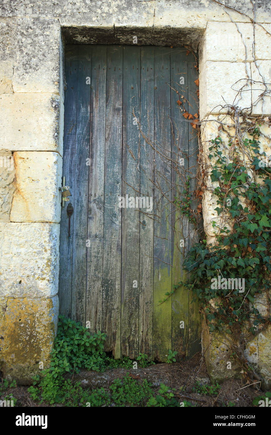 Old barn door on a farm building in the Dordogne region of France Stock Photo