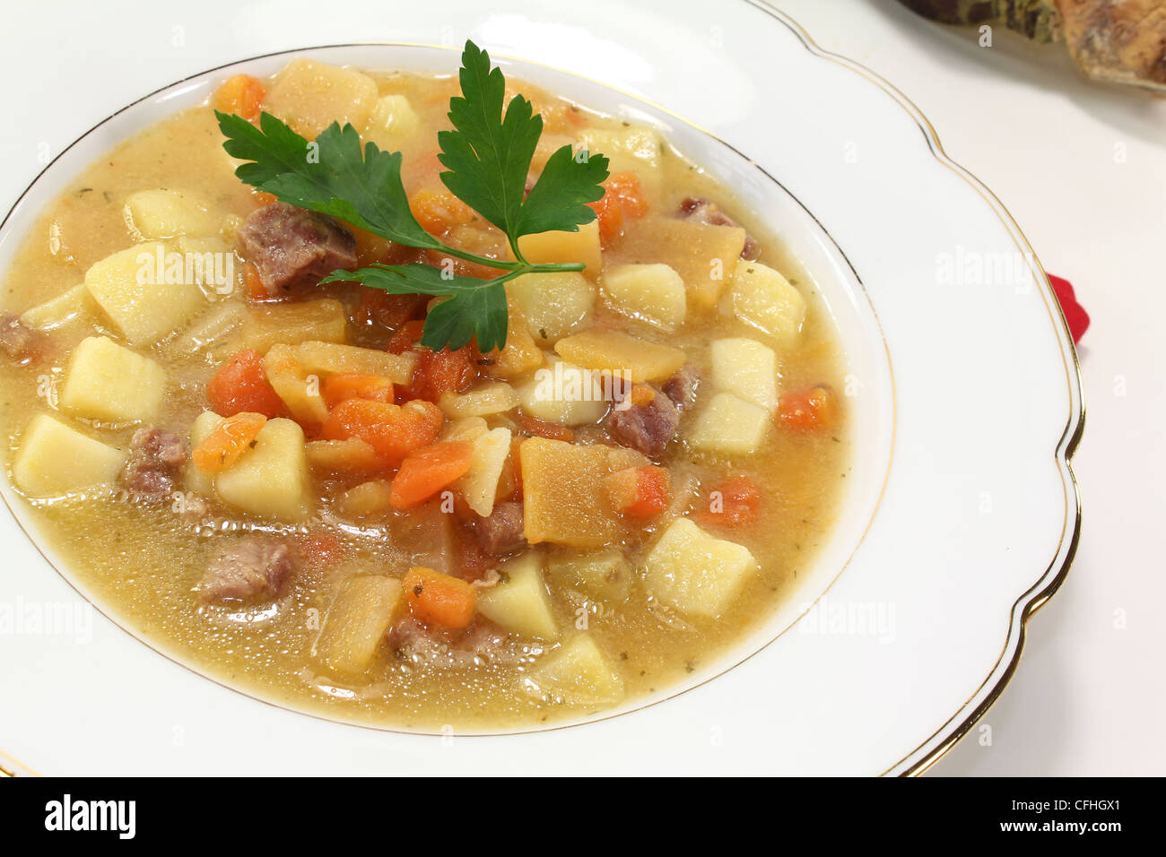 Turnip soup with beef, carrots, potatoes and parsley Stock Photo Alamy