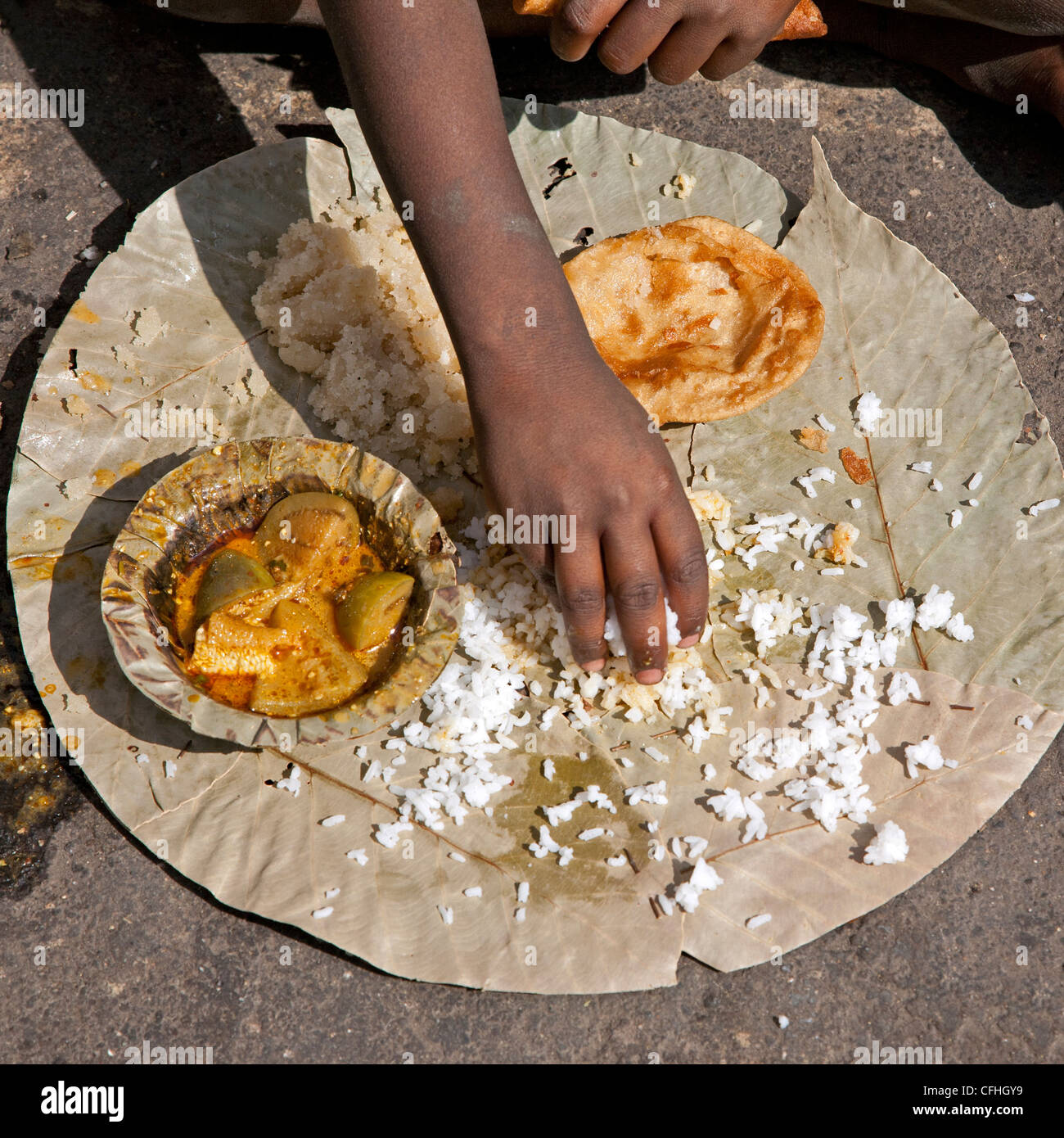 Boy eating a thali (traditional indian meal). Nasik. India Stock Photo