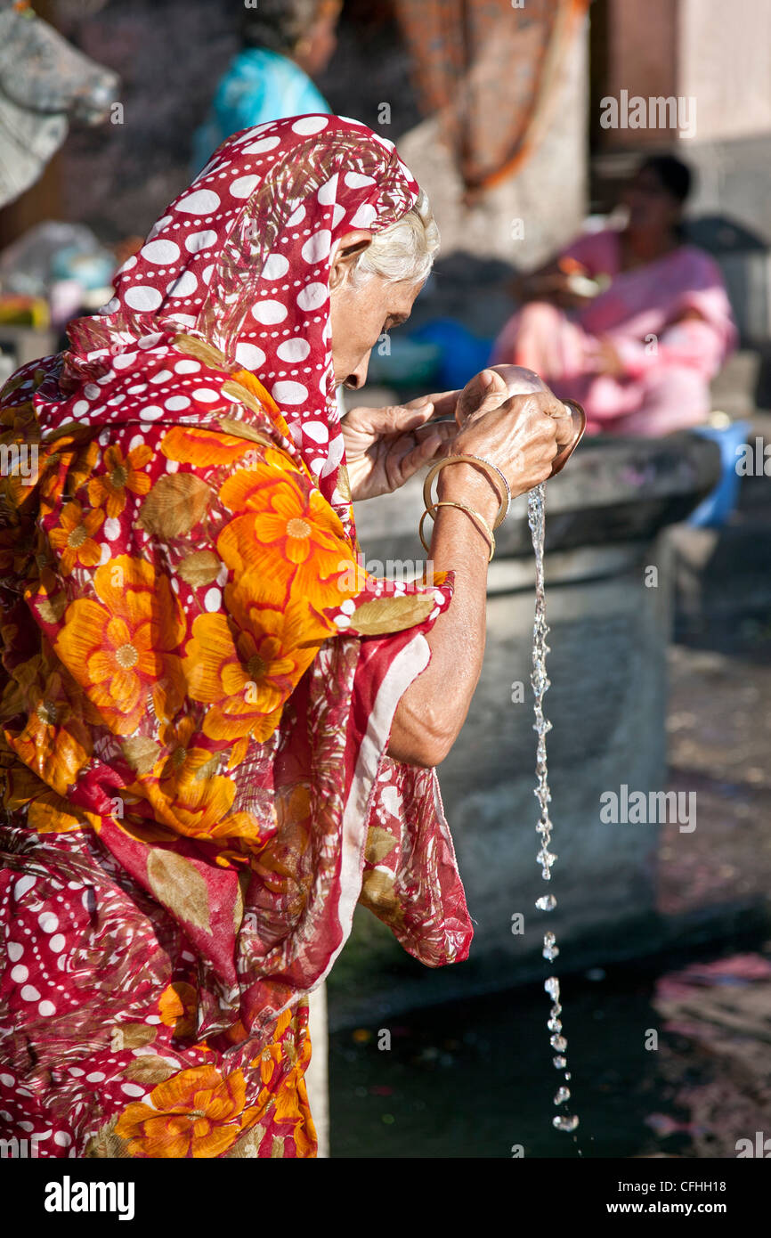 Hindu woman making a ritual ceremony. Godavari river. Nasik. India Stock Photo