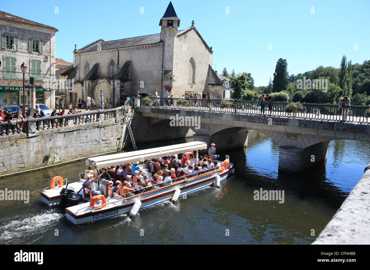Boat trip on the River Dronne which surrounds the pretty town of Brantome in the Dordogne region of France Stock Photo