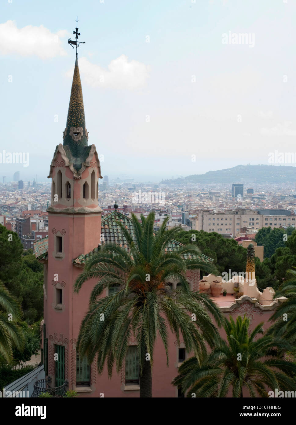 Gaudi House Museum with Barcelona in the haze in the distance in Park Guell Stock Photo