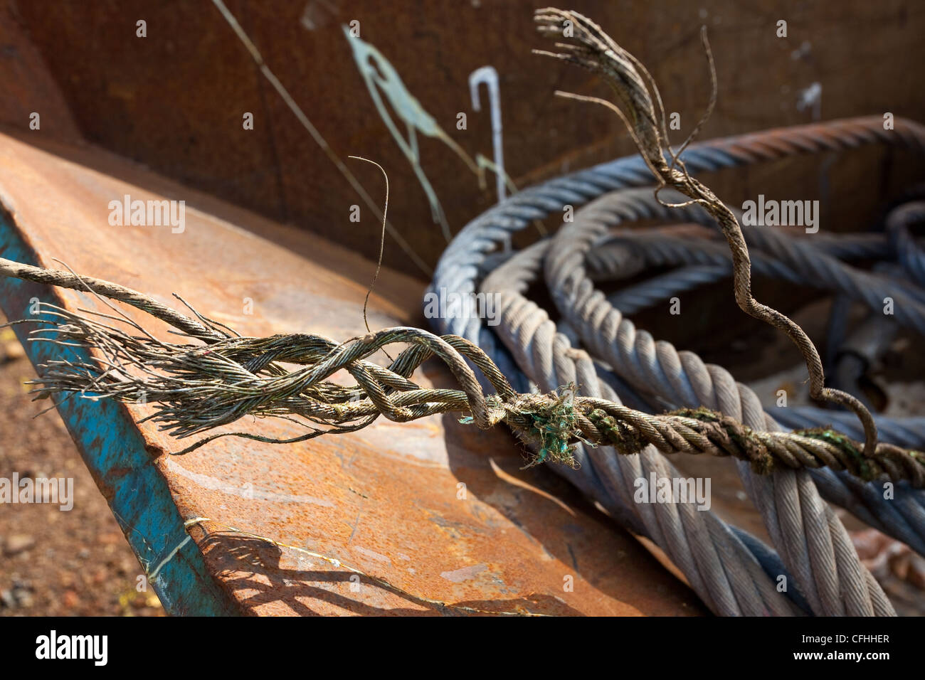 Close up of a corroded or broken steel wire rope left in waste skips
