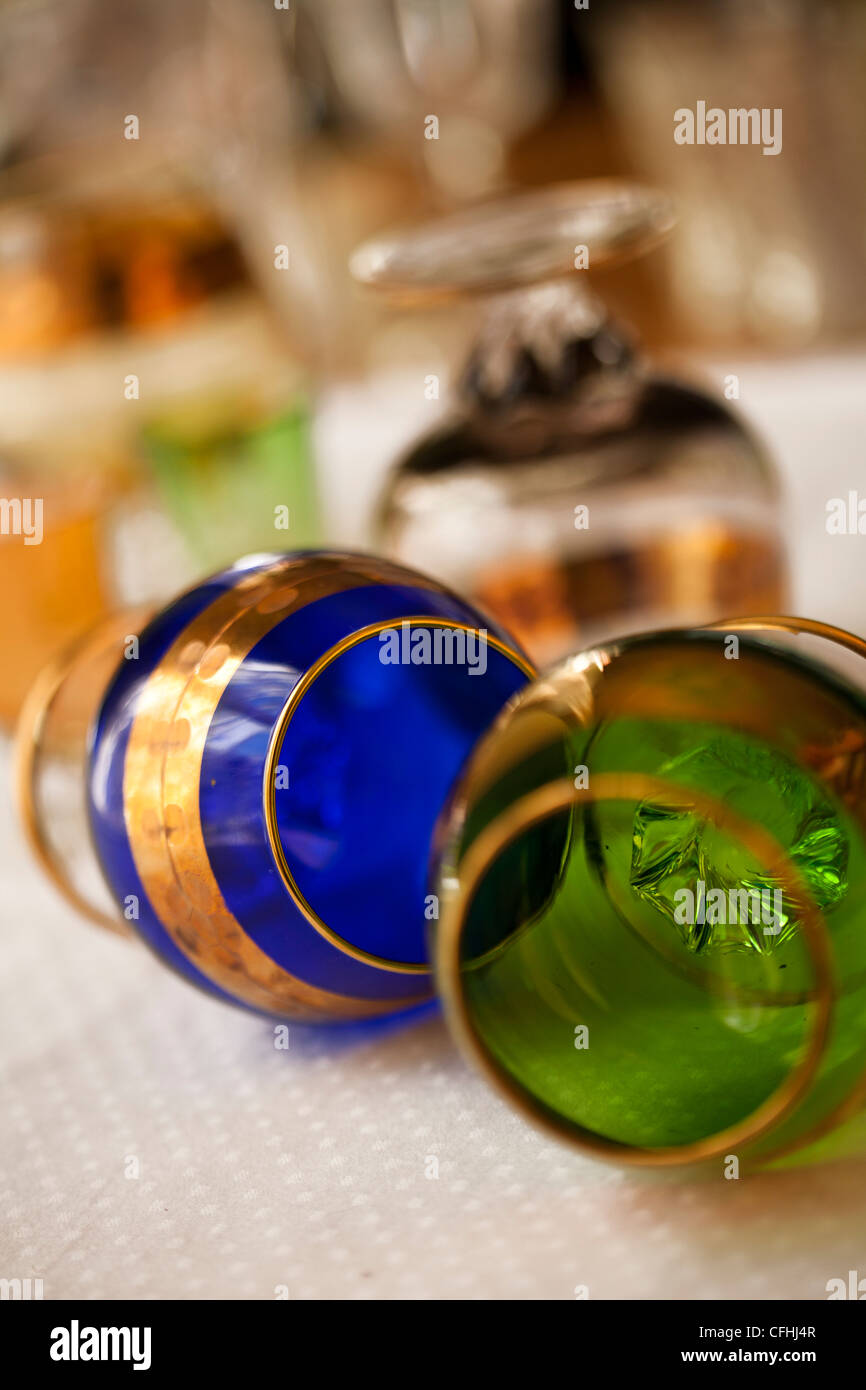 Hand blown etched crystal brandy snifters in blue and green with gold