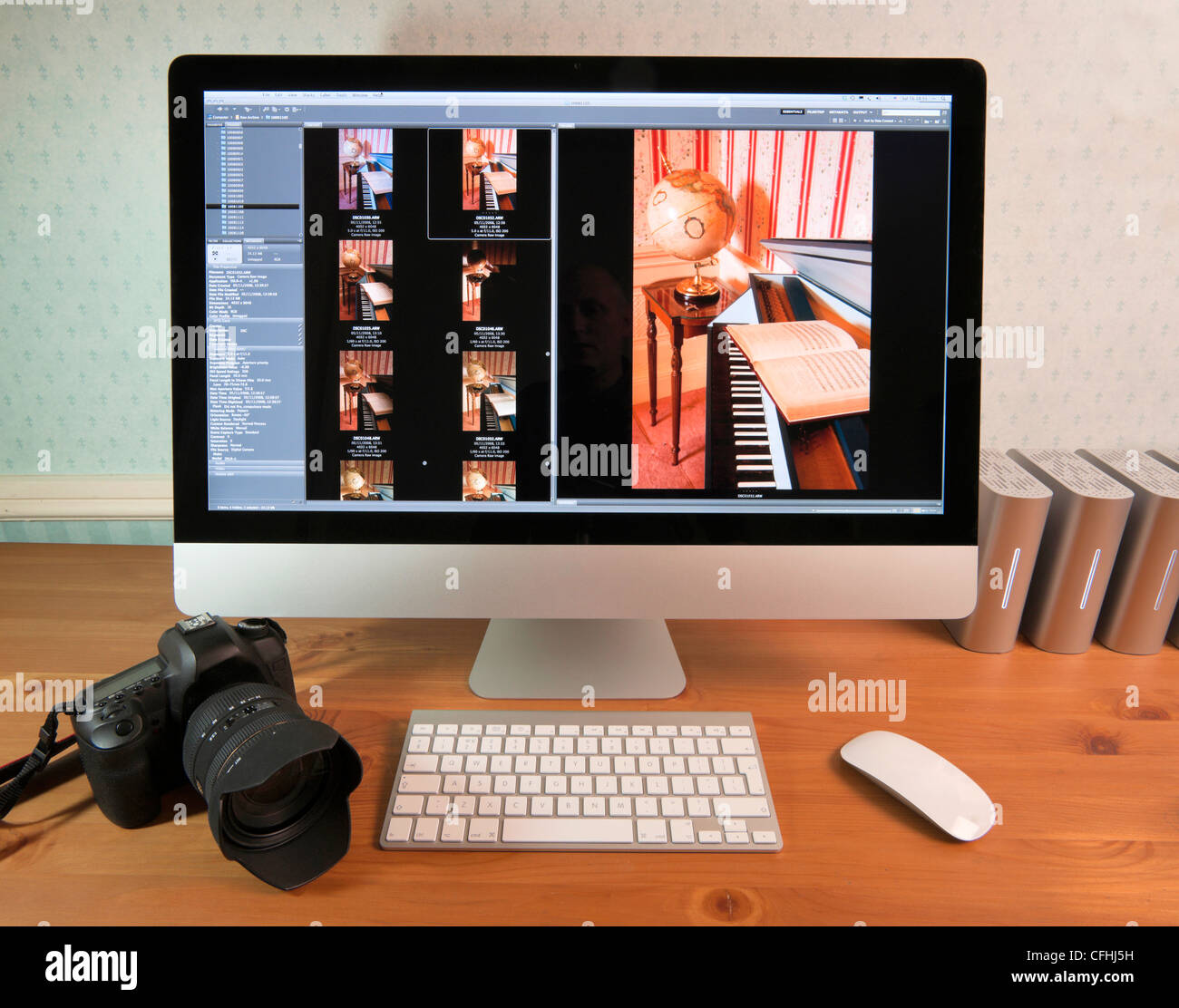 Apple iMac 27" i7 with DSLR camera keyboard and mouse external disks photo  browsing software - retouched to remove logos Stock Photo - Alamy