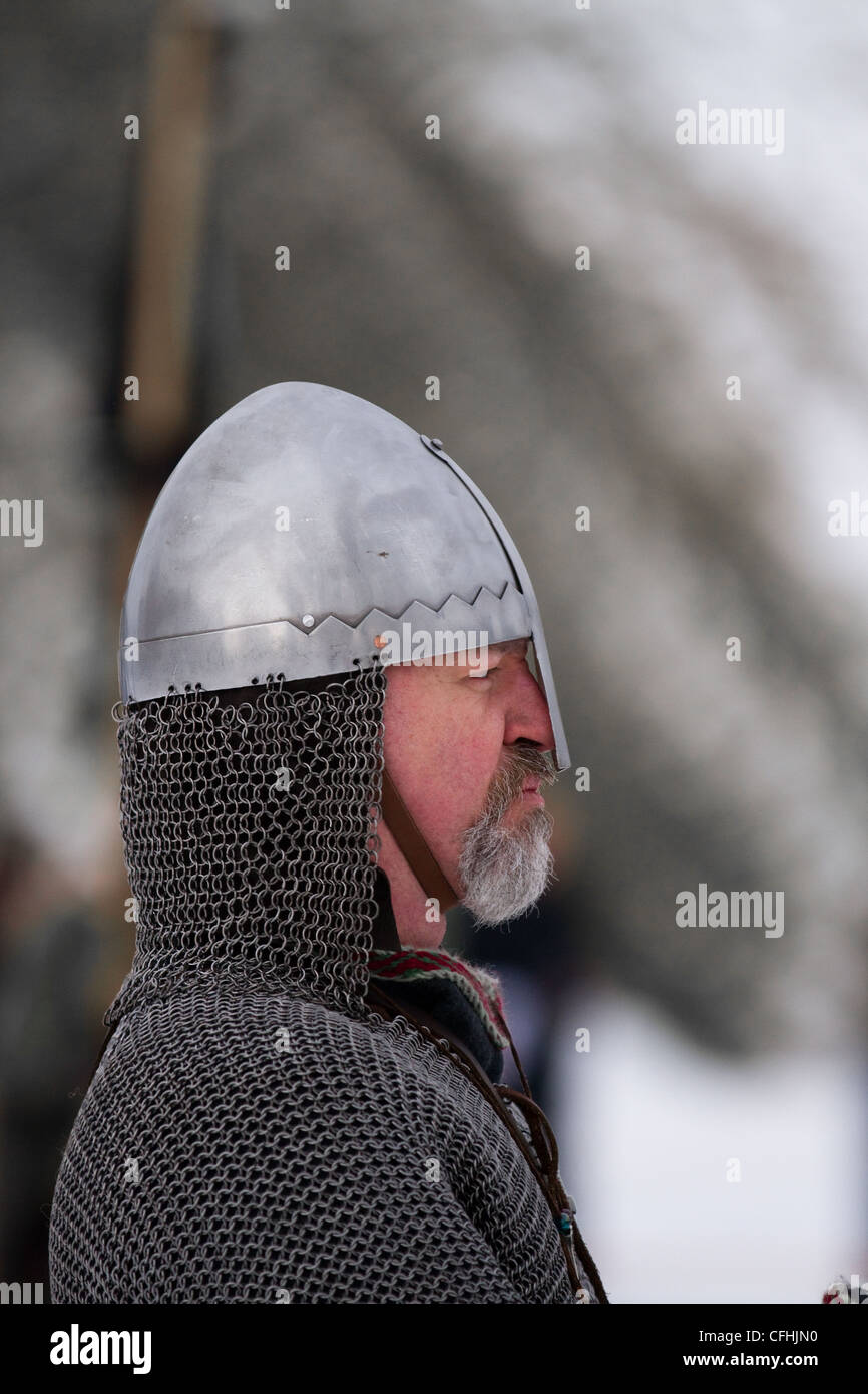 Viking re-enactor wearing chain mail. a helmet and carrying sword at the 27th Annual JORVIK Festival in York, UK Stock Photo