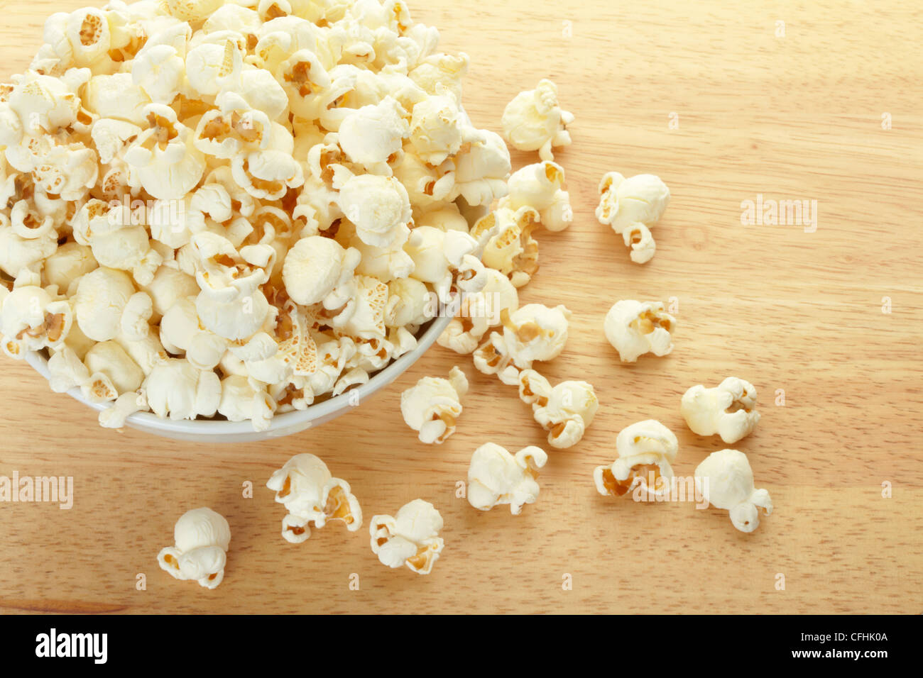 Popcorn bowl on wooden table background Stock Photo