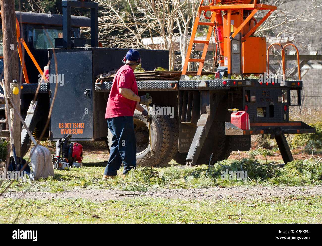 Tree service truck and man with rake Stock Photo Alamy