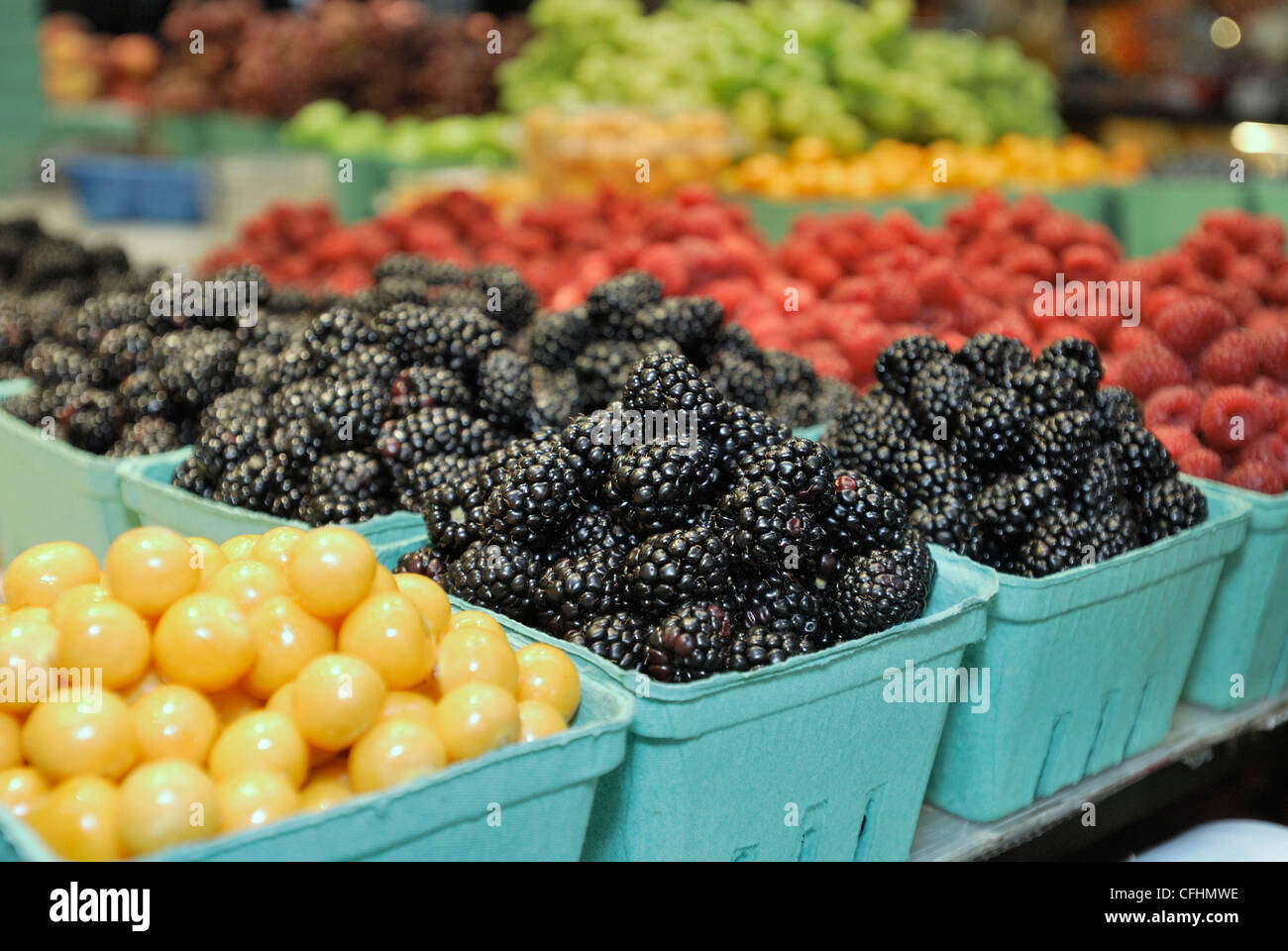 Fruit stand with a display of blackberries at Granville Island Farmers Market, Vancouver City, British Columbia. Stock Photo