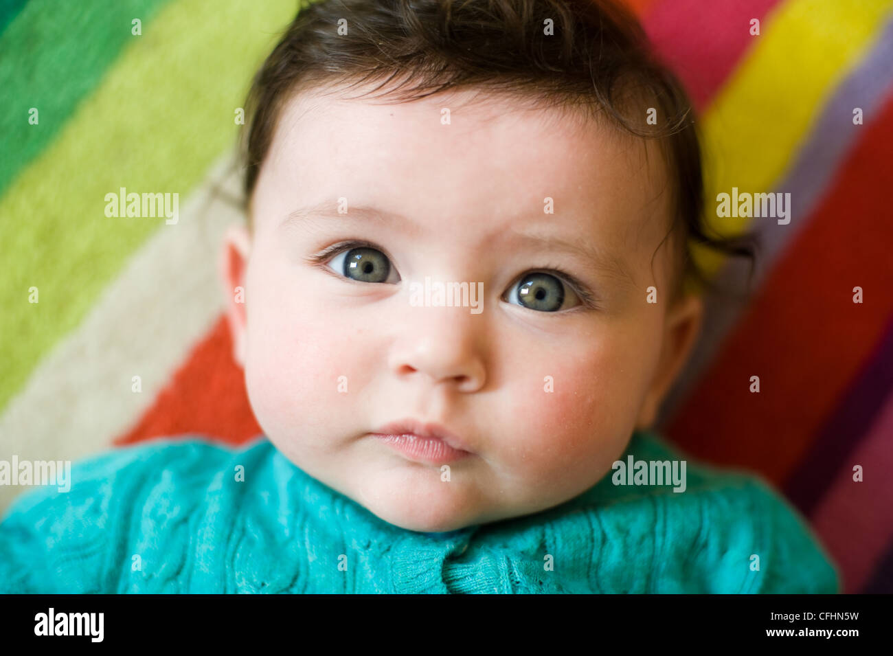 Beautiful baby girl with blue eyes and brown hair lying on floor at home looking at camera Stock Photo - Alamy Beautiful baby girl with blue eyes and brown hair lying on floor at home looking at camera Stock Photo - Alamy