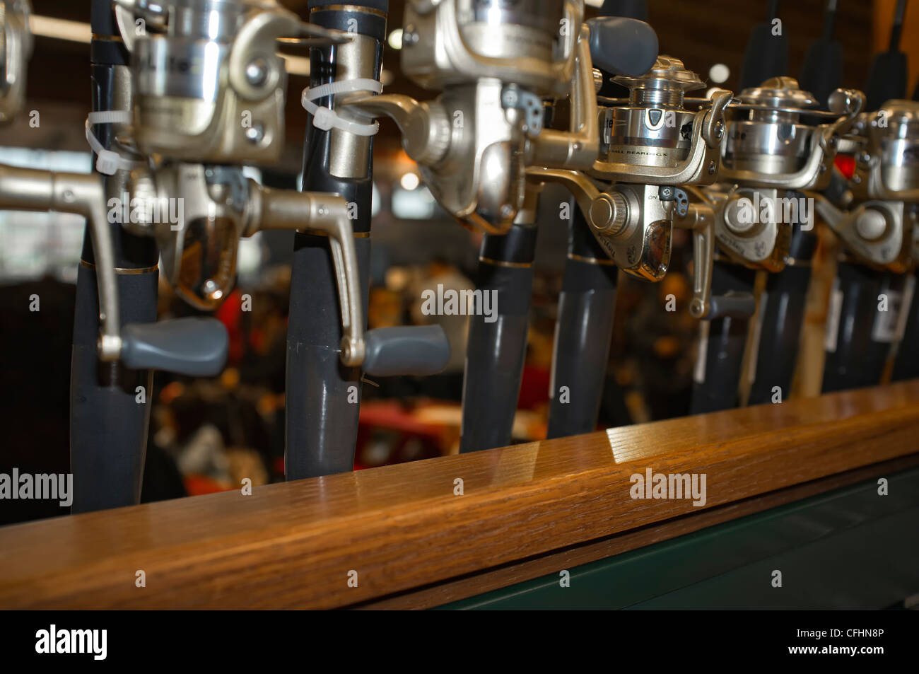 Fishing reels on shopping display rack Stock Photo Alamy