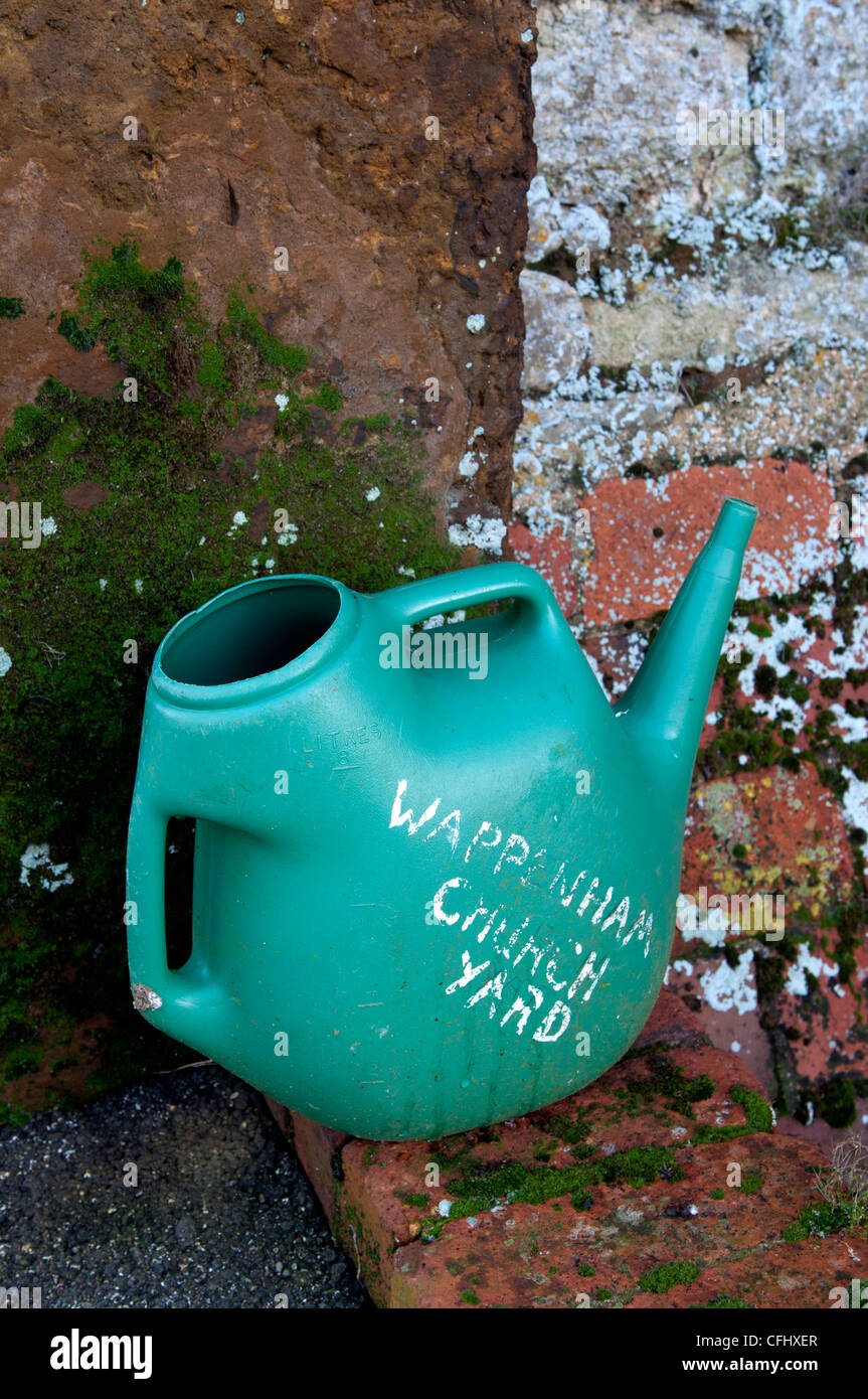 Churchyard watering can Stock Photo Alamy