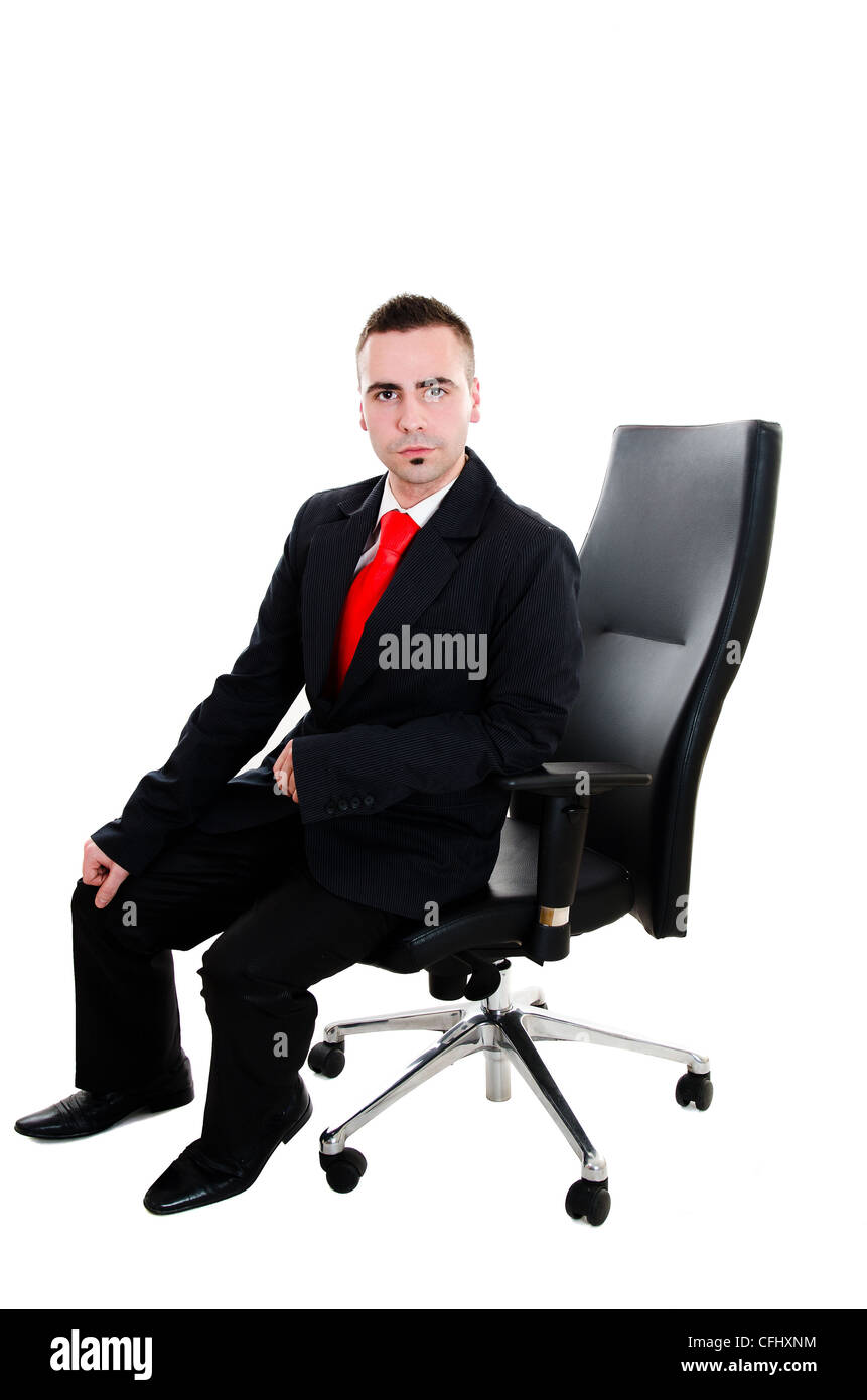 Young businessman sitting in office leather armchair - isolated on white background Stock Photo